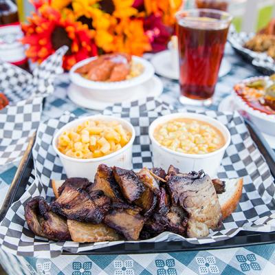Smoked brisket, served with cheesy corn, and mac and cheese.