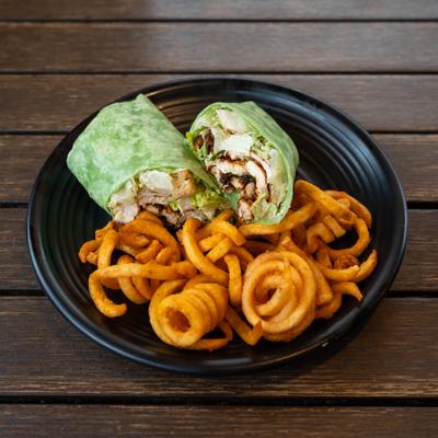 Chicken Caesar Wrap with curly fries.