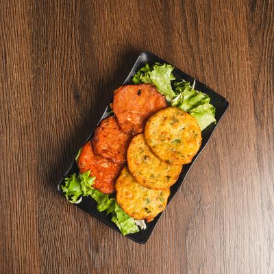 Kimchi and Seafood Pancakes served over lettuce.