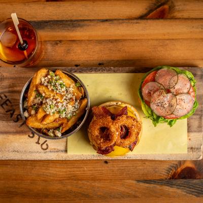 BBQ Bacon burger served with truffle fries, accompanied with Old Fashioned.
