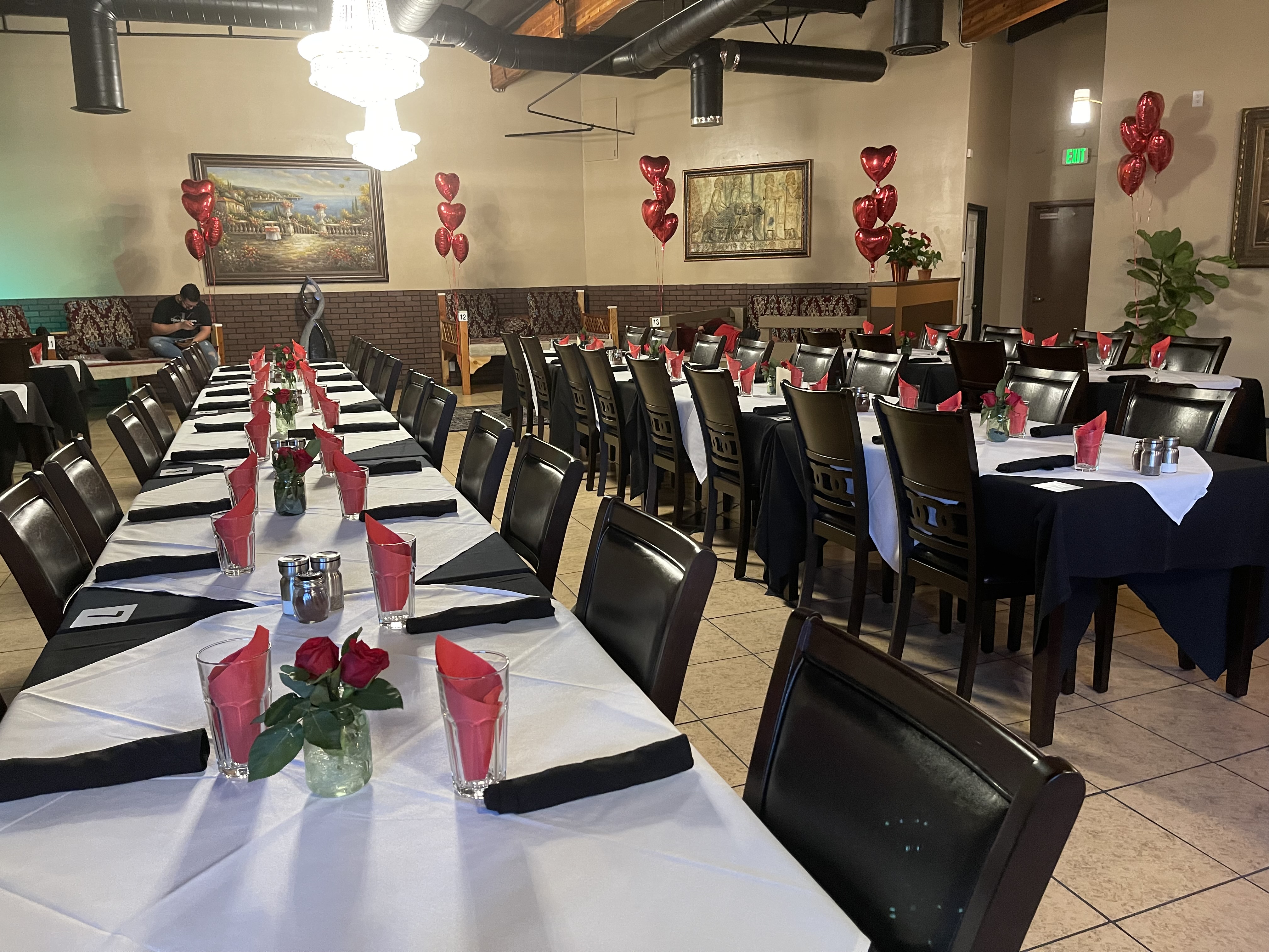 Zereshk Polo & Chicken Kabob plate with tea, beer and salad dressing in the background.