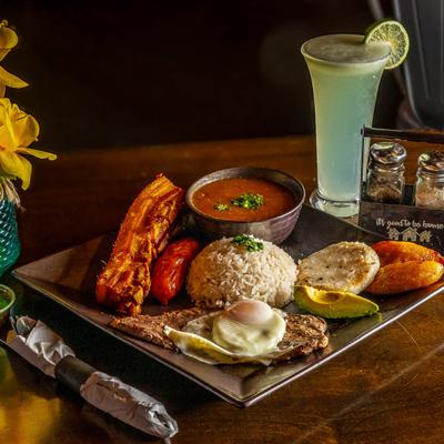 Bandeja Paisa plate with a variety of food prepared in a traditional way.