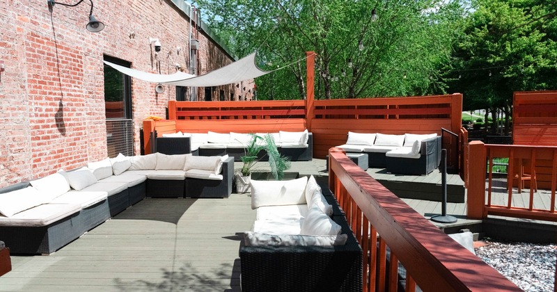 Exterior seating area with chairs, coffee tables and garden sofas