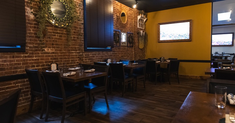 Modern and cozy interior dining area with set tables