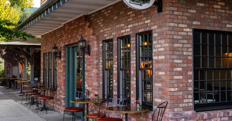 Exterior, angle view, sidewalk patio, tables and chairs