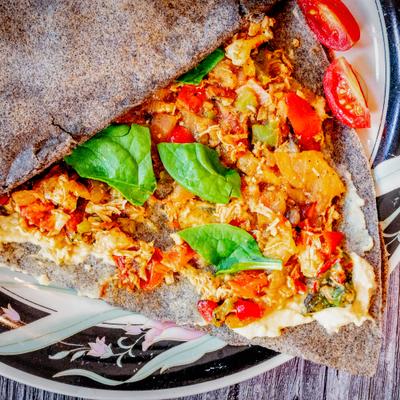 Buckwheat crepe with sauteed vegetables and fresh spinach.