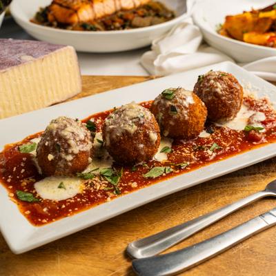 Arancini with mozzarella, ricotta, reggiano and basil pomodoro.