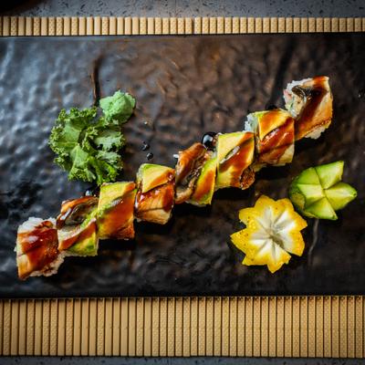 Green Dragon Roll topped with eel, avocado and eel sauce, overhead view.