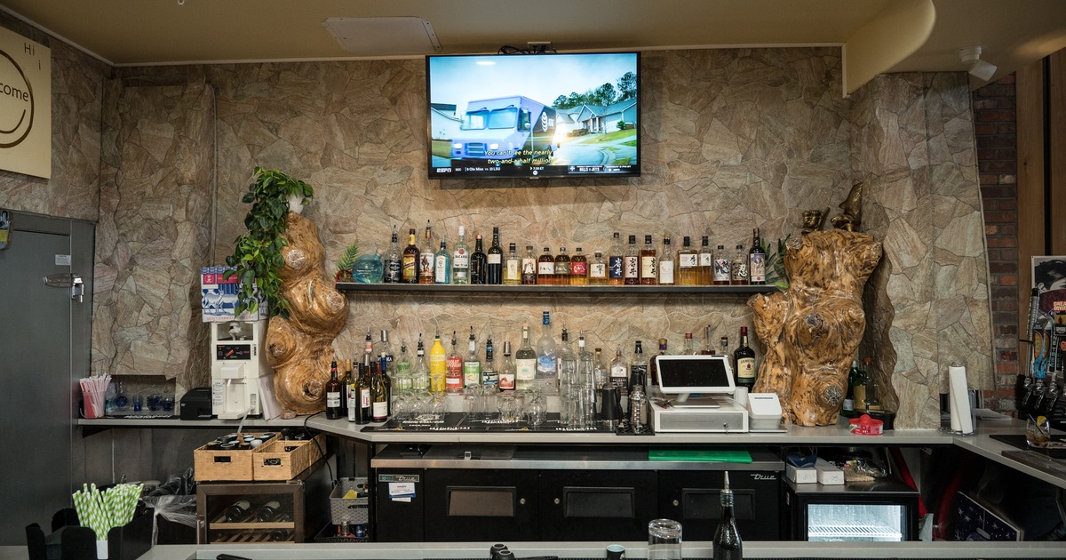 Interior, sushi bar, chairs, tv above