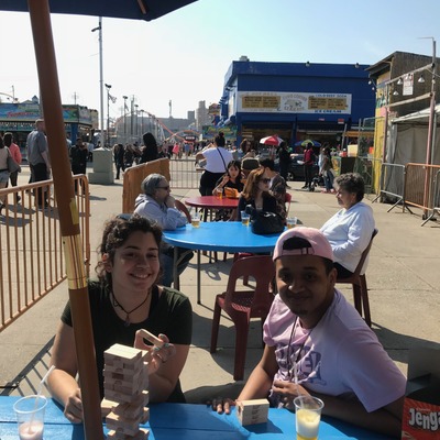 Exterior, two guests posing for a photo.