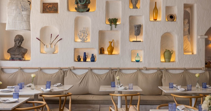 Interior seating area, drywall shelves with variety of Greek decoration