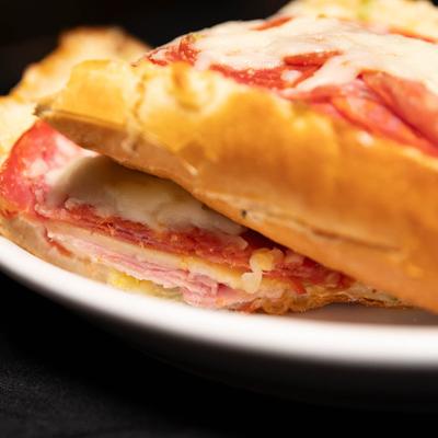 Grinders with salami, pepperoni, and cheese.