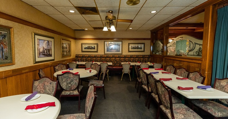 Interior, dining tables and seating, walls decorated with pictures