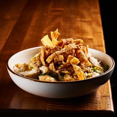 Asian Chicken Salad topped with crispy wontons.