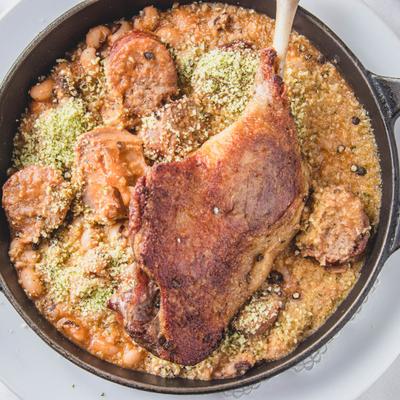 Grilled sliced meat and vegetables on the side