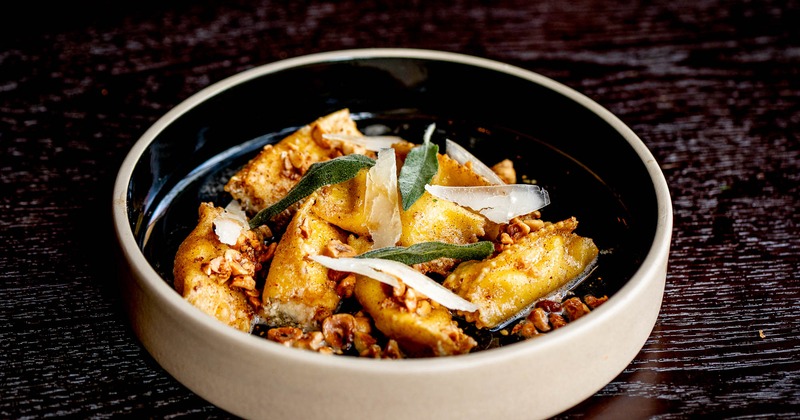 A dish of pasta squares stuffed with four cheeses