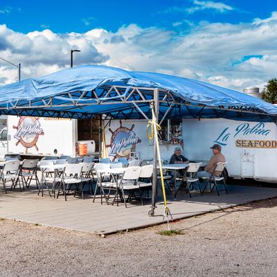 Food cart outside, seating area.