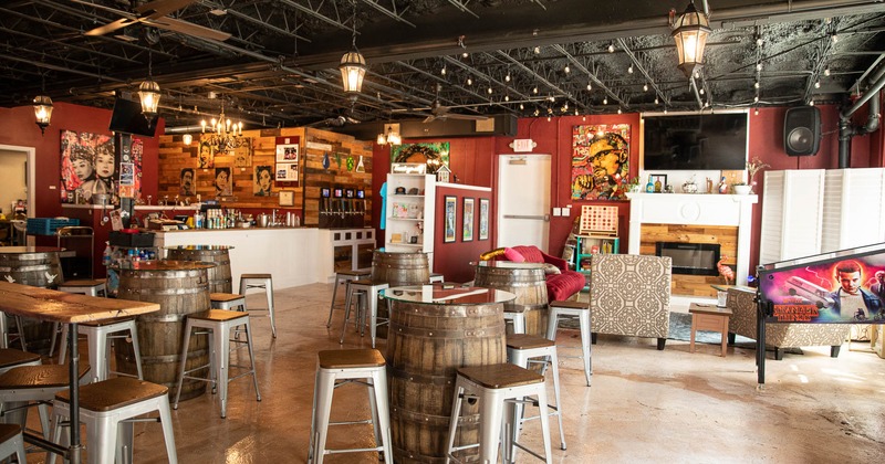 Interior, bar area, big tv and a pinball machine