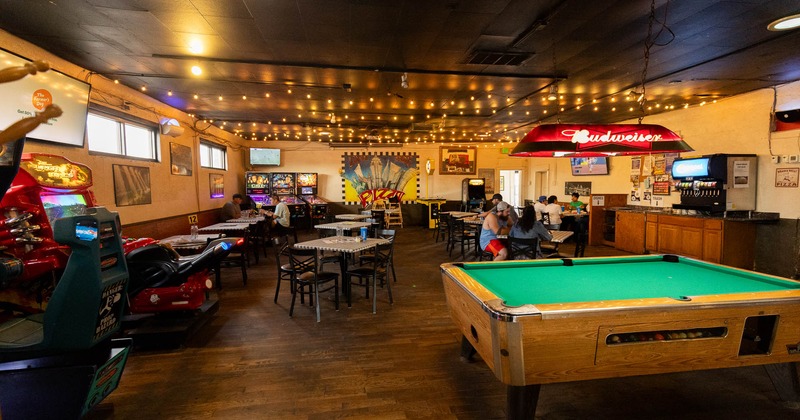 Interior, dining area and bar area on the right
