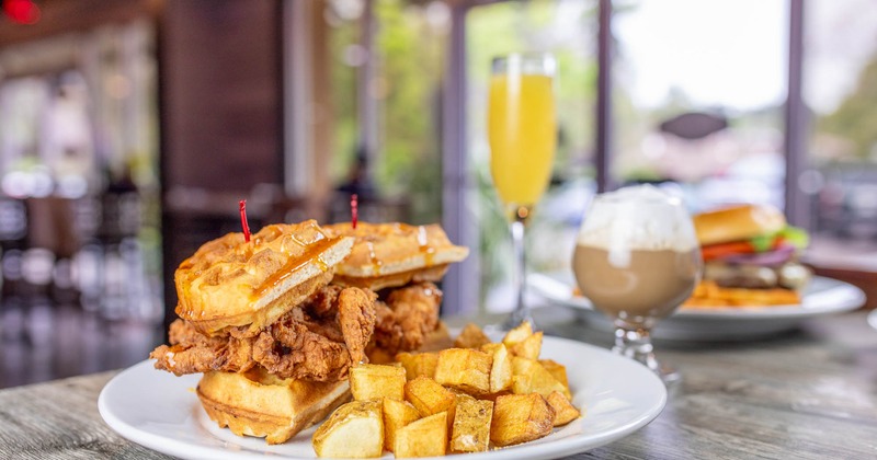 Chicken waffle sandwich, with breakfast potatoes