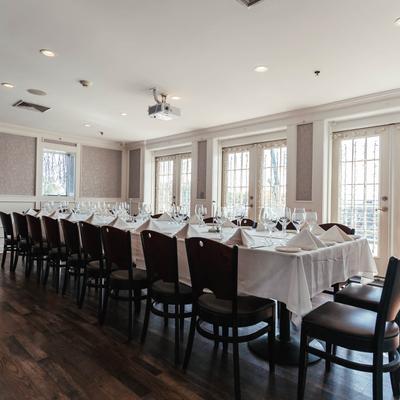 Joined dining tables, fully set.