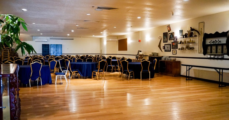 Interior, wide view, tables and chairs ready for guests