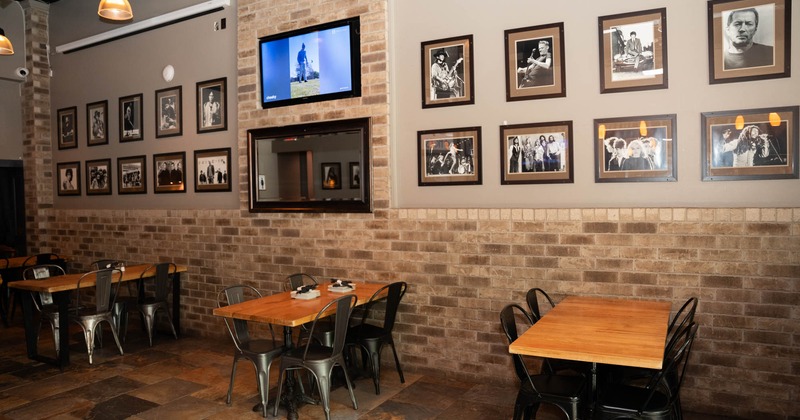 Interior, tables and chairs, framed pictures on the wall