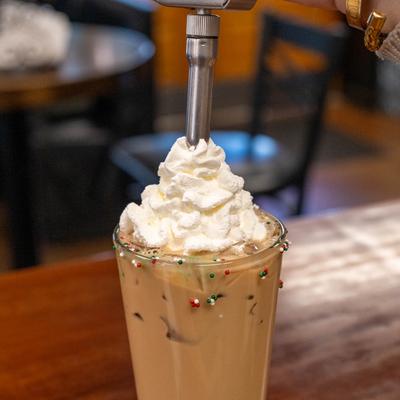 Coffee topped with whipped cream.