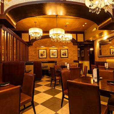 Interior, dining room, tables with tableware and seating.