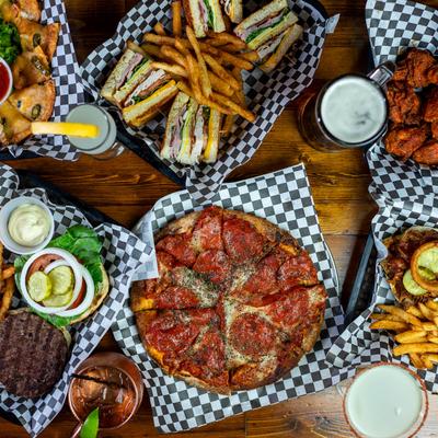 Various dishes and drinks on a table, top view.
