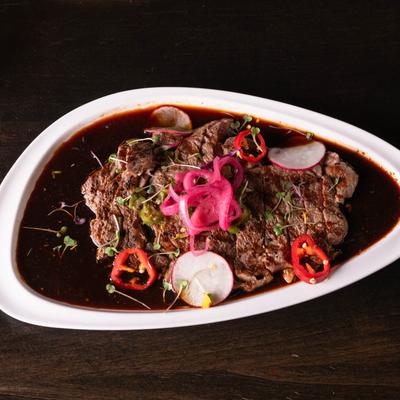 Grilled ribeye in ponzu sauce, with peppers, pickled red onion, and cilantro.