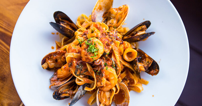 Different types of sea food and vegetables closeup