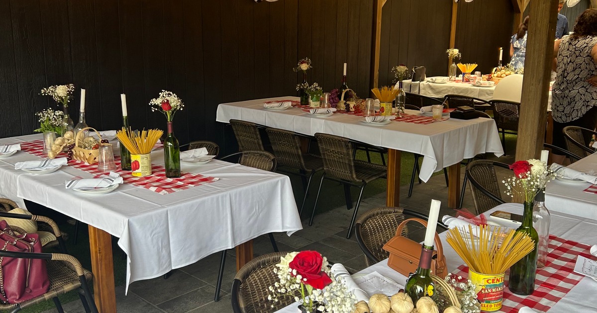 A dining area in a restaurant, showcasing tables and chairs prepared for a celebratory gathering