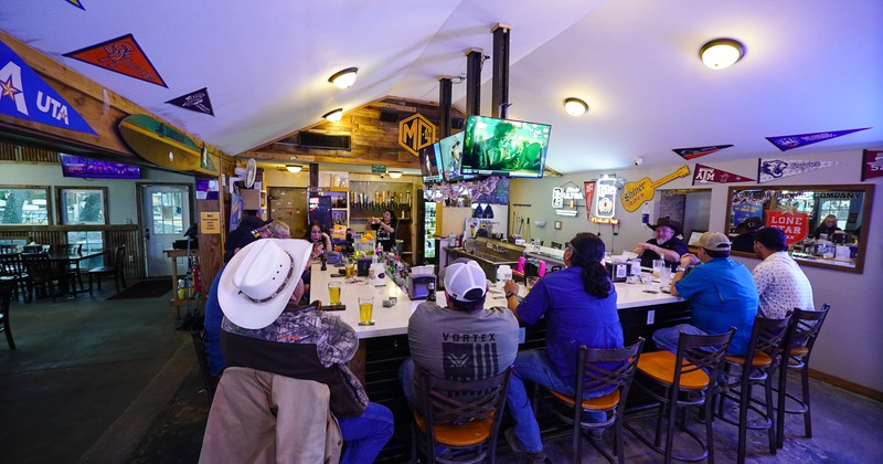 Customers sitting at the bar