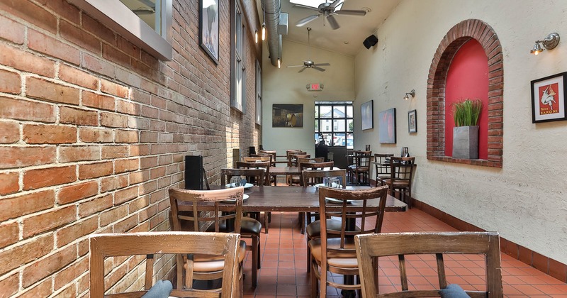 Interior, tables set for guests in dining area