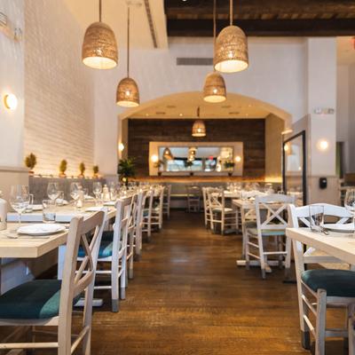 Fully set dining room tables.