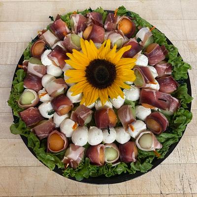 Prosciutto wrapped fruit balls and cheese