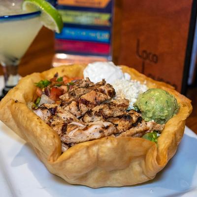Grilled chicken taco bowl, with mixed vegetables, guacamole and sour cream