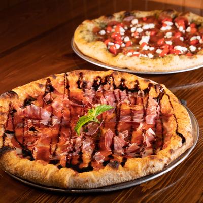 Pepperoni, salami, and prosciutto pizza, with mozzarella, tomato sauce and balsamic