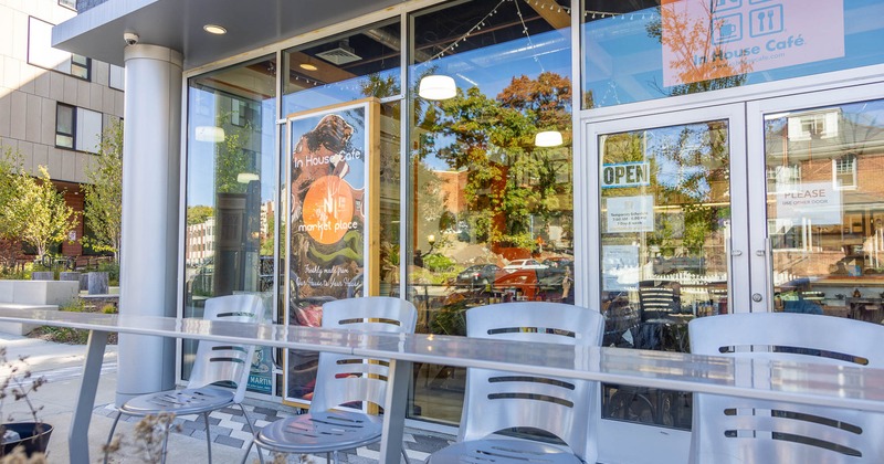 Exterior, high table and chairs near entrance