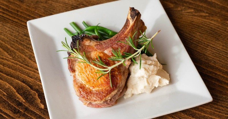 Porter house pork chop, served