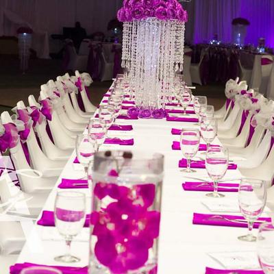 Long banquet table with purple accents.