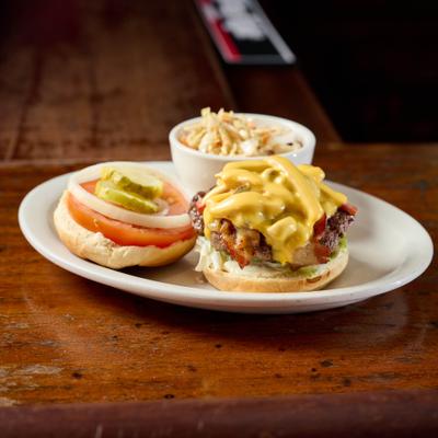 Zola Burger with bacon, onions, mushrooms, cheese and side of coleslaw.