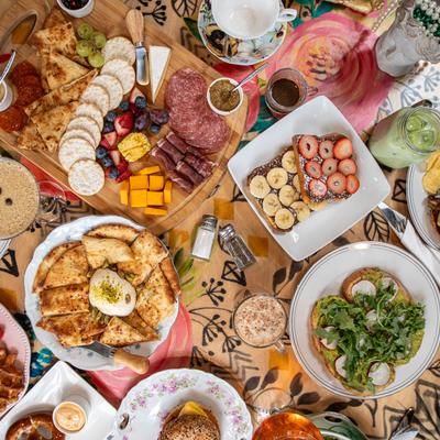 Miscellany of food and drinks, overhead view.