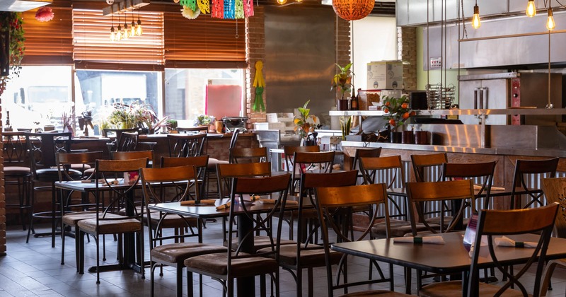 Inside, seating area with tables and chairs