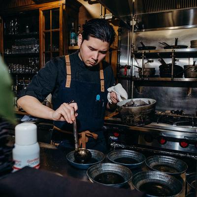 Chef plating dishes.