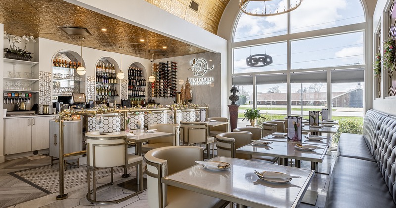 Nicely done interior dining area with set tables and bar area