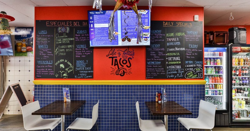 Interior, chairs and tables, TV on the wall