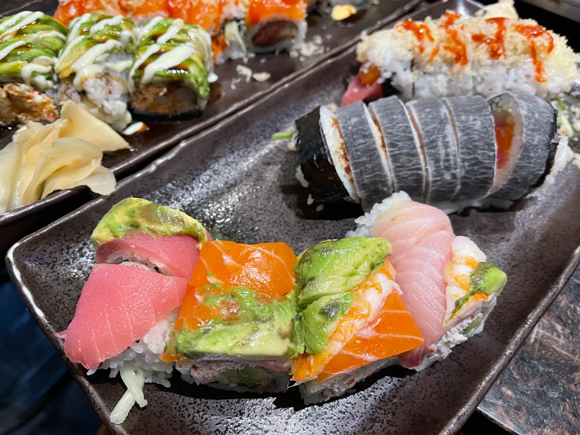 Various types of sushi on plate, close up