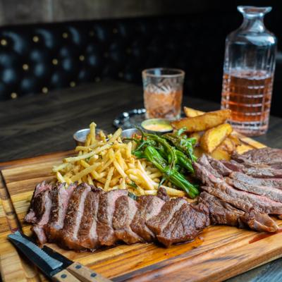 Steak with fries, peppers and sweet potato platter